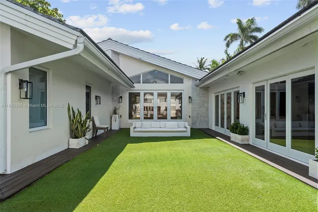 a view of swimming pool with outdoor seating