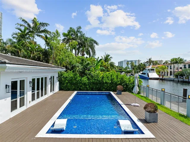 a view of swimming pool with seating space