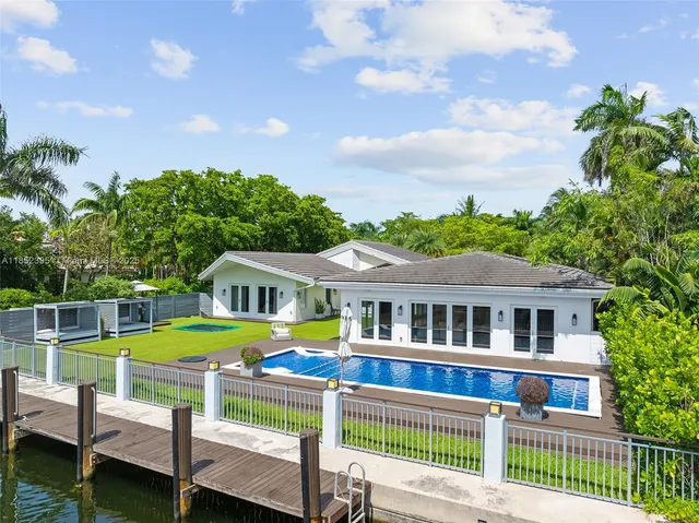 a front view of house with outdoor space swimming pool and furniture