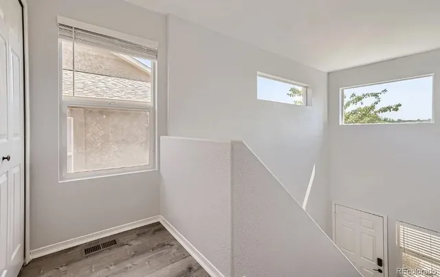 a view of room with window and hallway