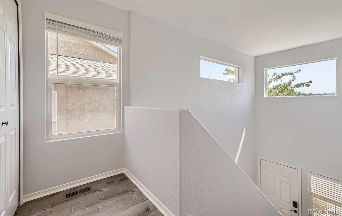 5925-5943 University Village View Colorado Springs, CO 80918 - Photo 11 of 21 a view of room with window and hallway