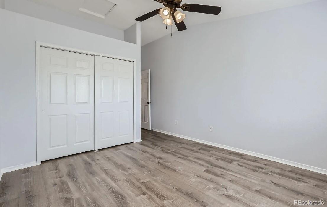 5925-5943 University Village View Colorado Springs, CO 80918 - Photo 19 of 21 wooden floor in an empty room