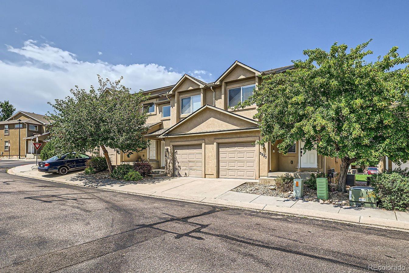 5925-5943 University Village View Colorado Springs, CO 80918 - Photo 2 of 21 front view of a house with a street
