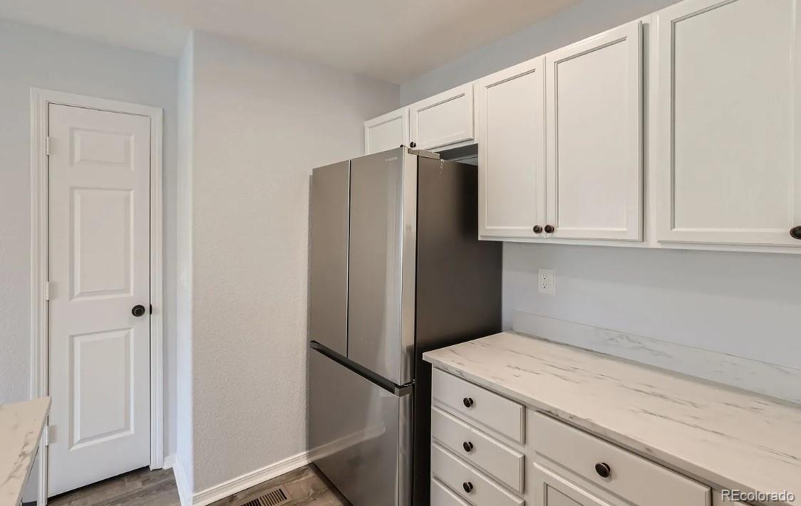 5925-5943 University Village View Colorado Springs, CO 80918 - Photo 8 of 21 a kitchen with appliances and cabinets