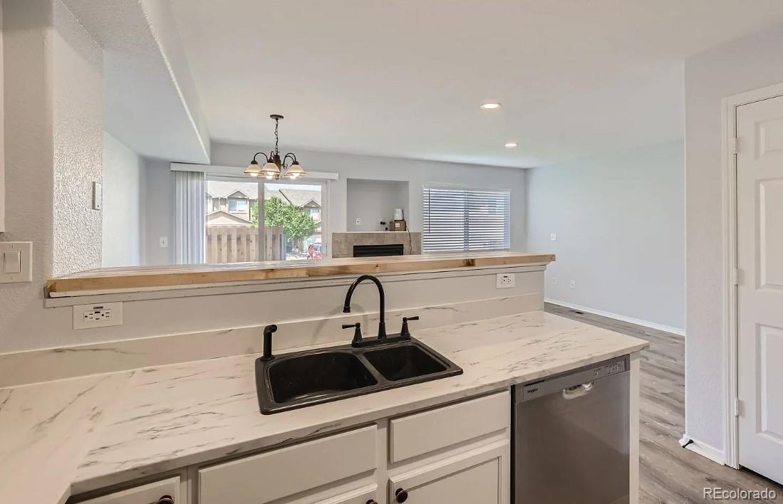 5925-5943 University Village View Colorado Springs, CO 80918 - Photo 9 of 21 a kitchen with a sink and a window