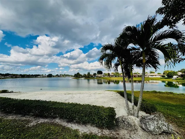 a view of a lake with a yard