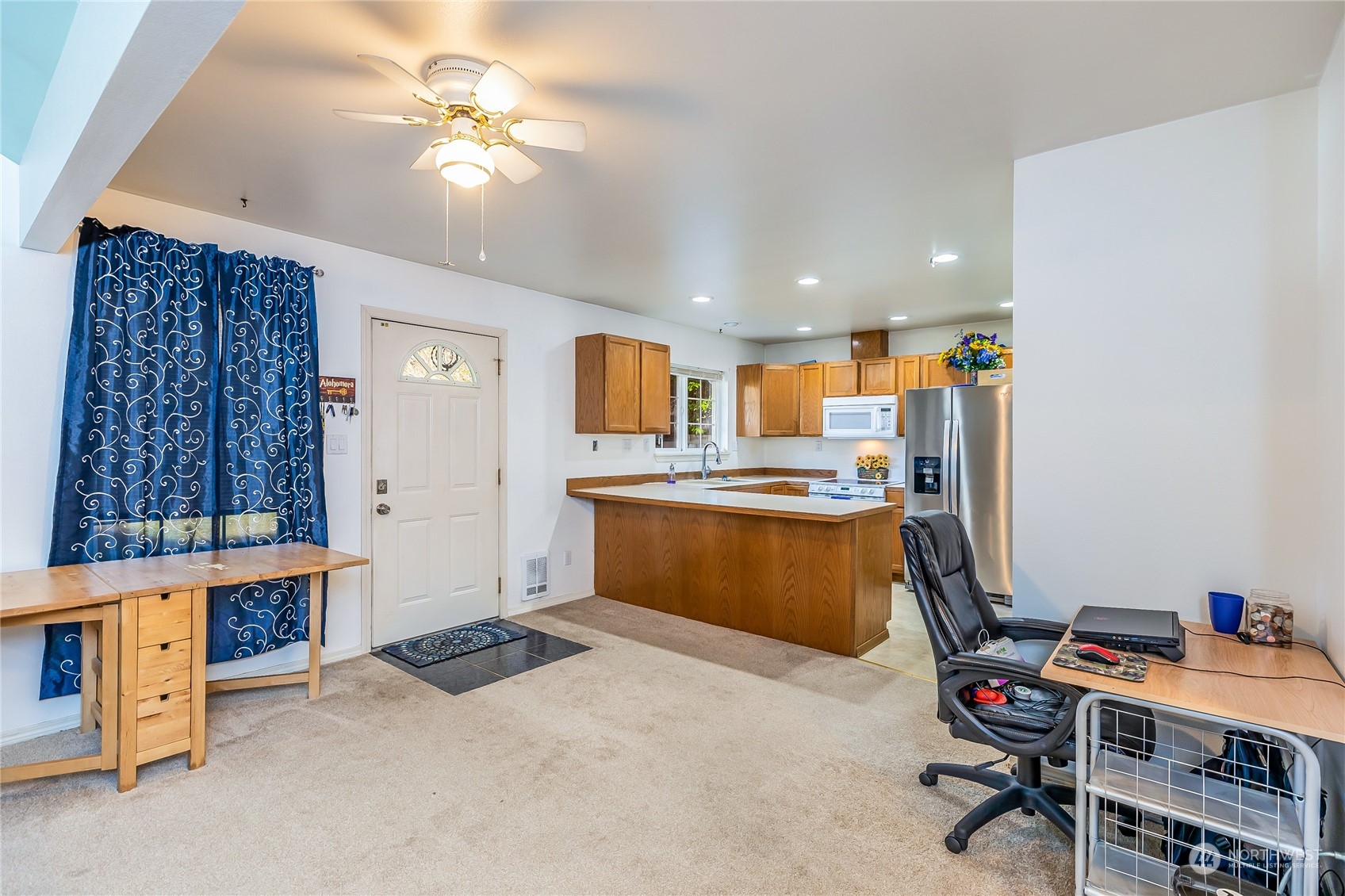 24 157th Place Southeast Bothell, WA 98012 - Photo 13 of 27 a kitchen with stainless steel appliances kitchen island granite countertop a sink and cabinets
