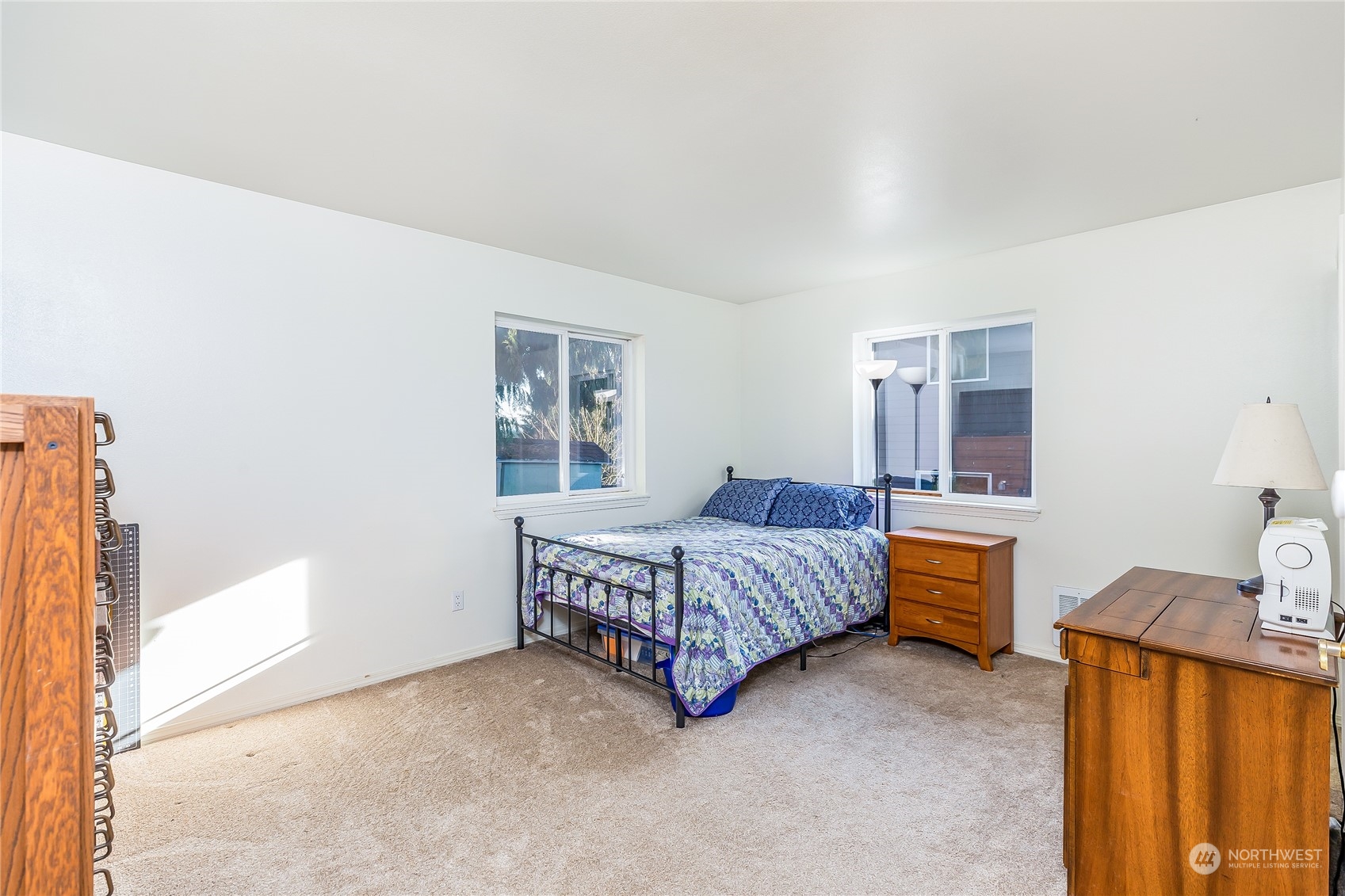 24 157th Place Southeast Bothell, WA 98012 - Photo 16 of 27 a spacious bedroom with a bed and a dresser in it