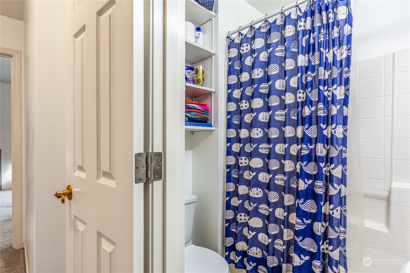 24 157th Place Southeast Bothell, WA 98012 - Photo 23 of 27 a room with a door and a shower curtain