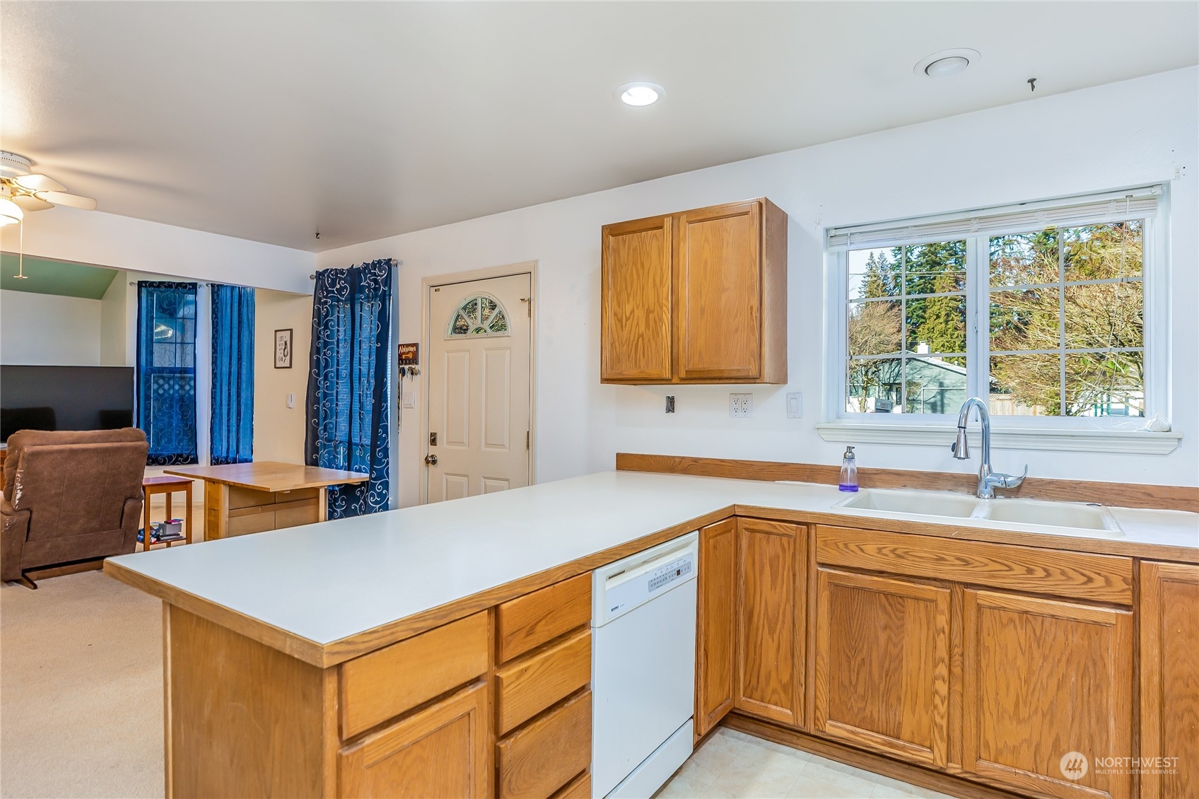 24 157th Place Southeast Bothell, WA 98012 - Photo 7 of 27 a kitchen with stainless steel appliances granite countertop a sink a stove and a refrigerator