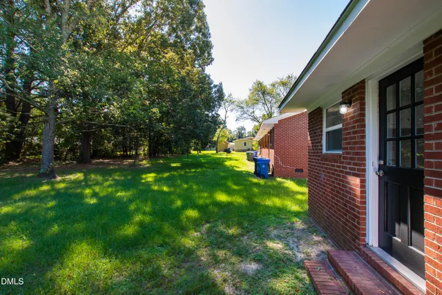 a backyard of a house with lots of green space