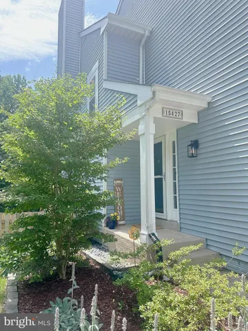 a house with a tree in front of it
