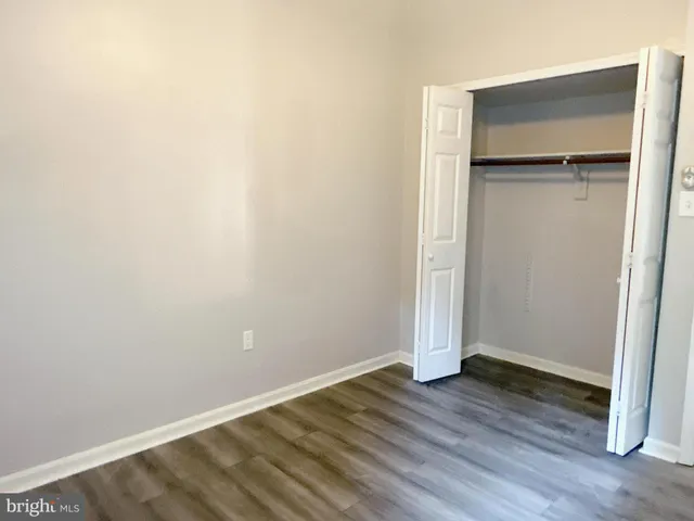 an empty room with wooden floor
