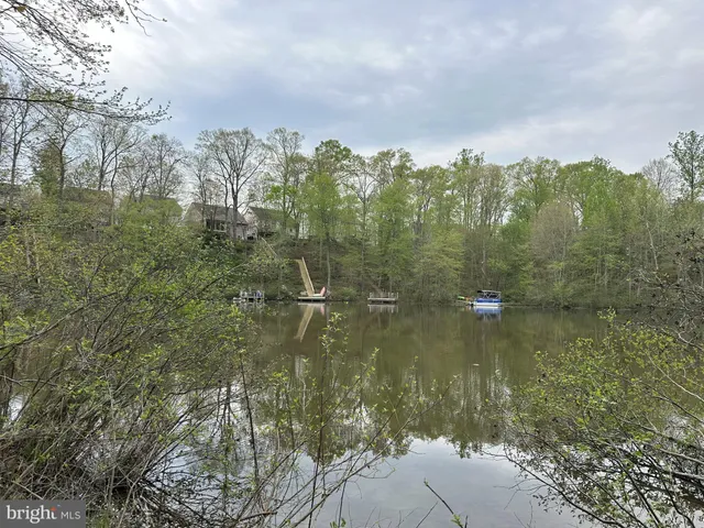 a view of a lake view with houses in back