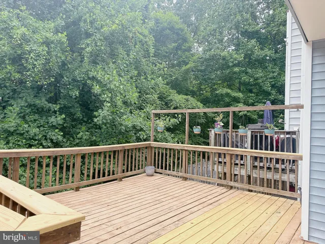 a view of balcony and wooden deck