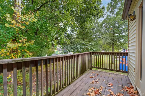 a view of balcony with wooden floor