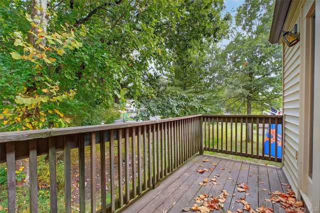 a view of balcony with wooden floor