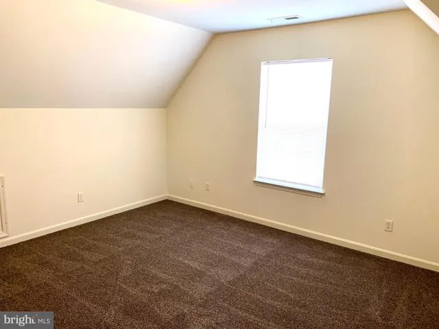 a white toilet sitting next to a bath tub