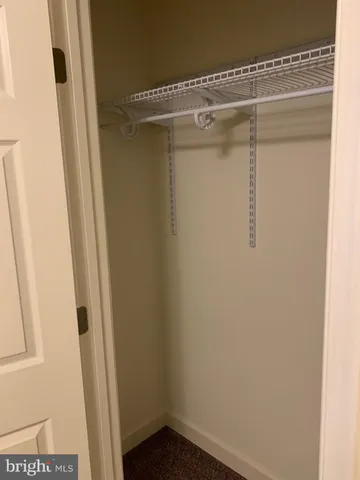 a view of an empty room with a fireplace