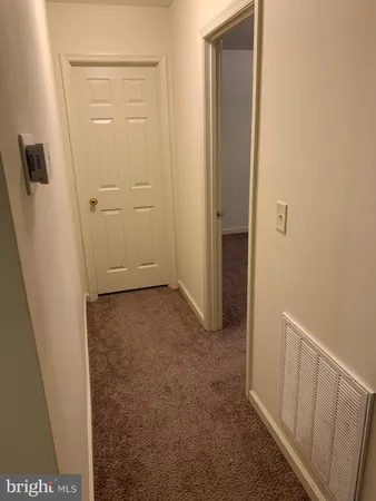 an empty room with wooden floor