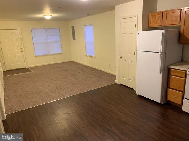 a white toilet sitting next to a bath tub