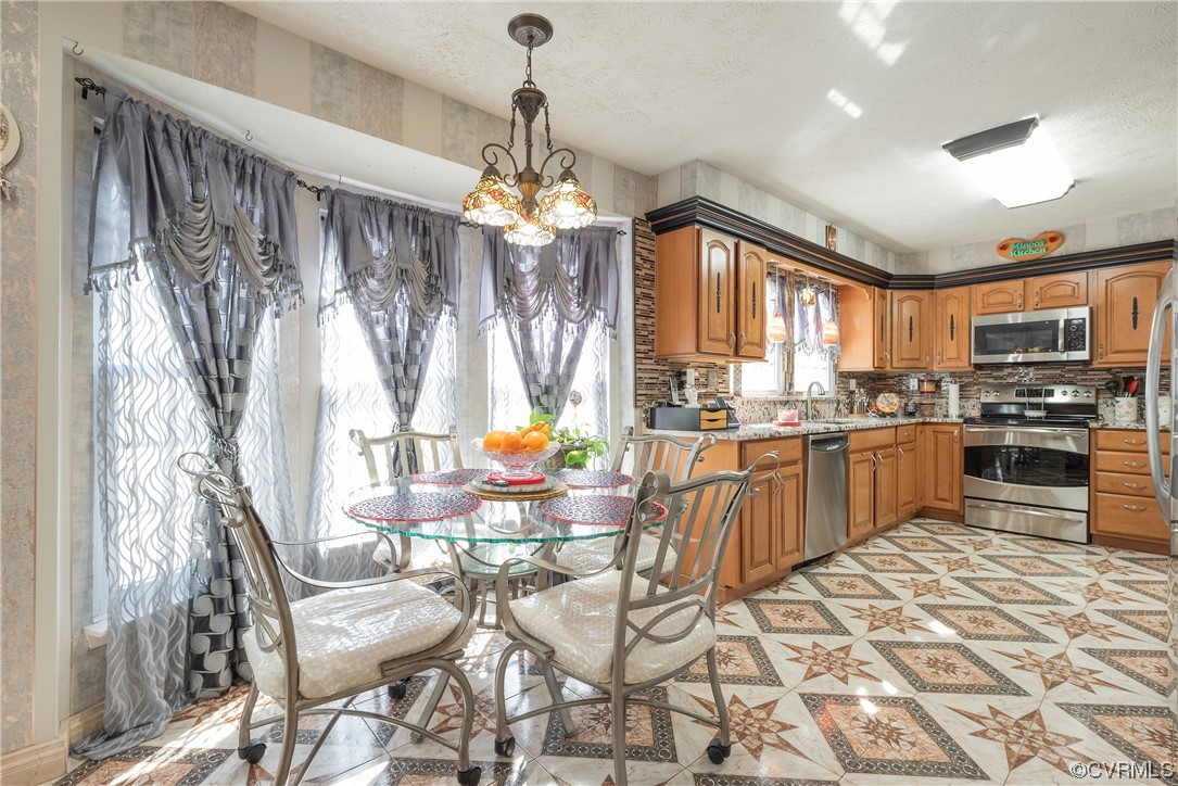 4109 Paces Ferry Road Chester, VA 23831 - Photo 13 of 40 a kitchen with stainless steel appliances granite countertop a refrigerator and a stove top oven