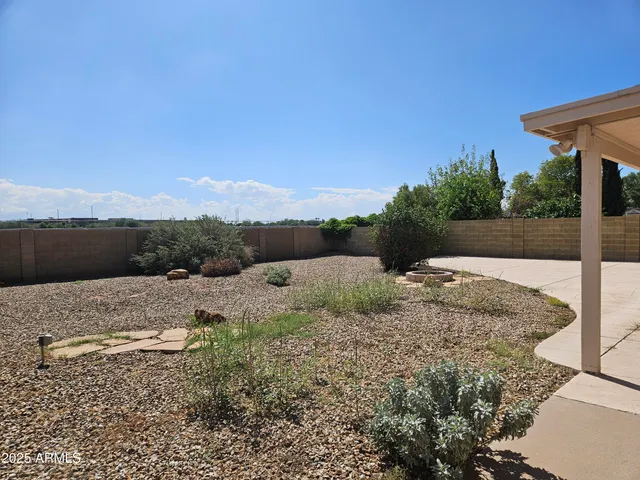 a view of balcony and yard