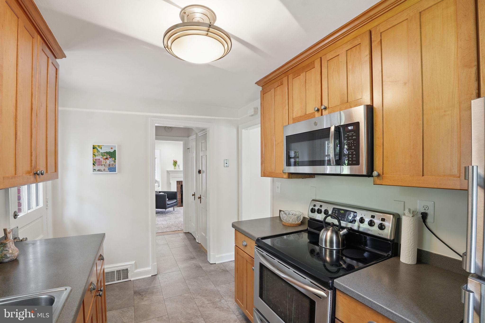9601 Bruce Drive Silver Spring, MD 20901 - Photo 13 of 29 Charming kitchen with warm wood accents.