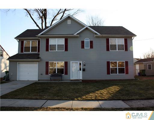 18 Caldwell Road Edison, NJ 08817 - Photo 1 of 11 a front view of a house with a yard