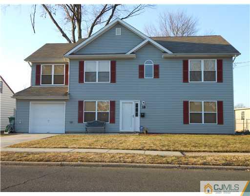 18 Caldwell Road Edison, NJ 08817 - Photo 2 of 11 a house that has a lot of windows in it