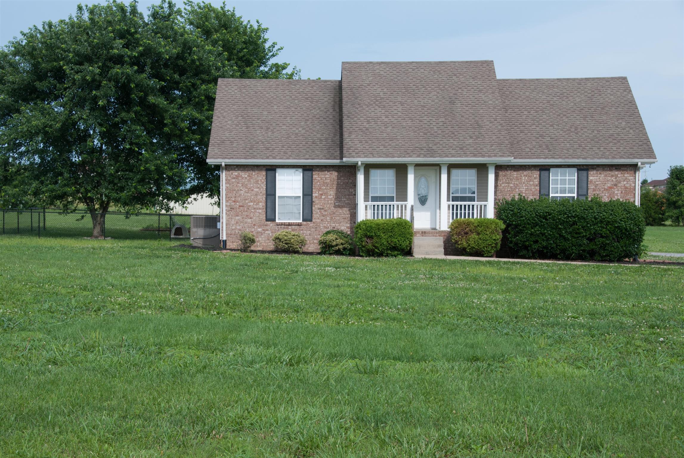 718 Lear Road Portland, TN 37148 - Photo 1 of 17 a front view of a house with garden