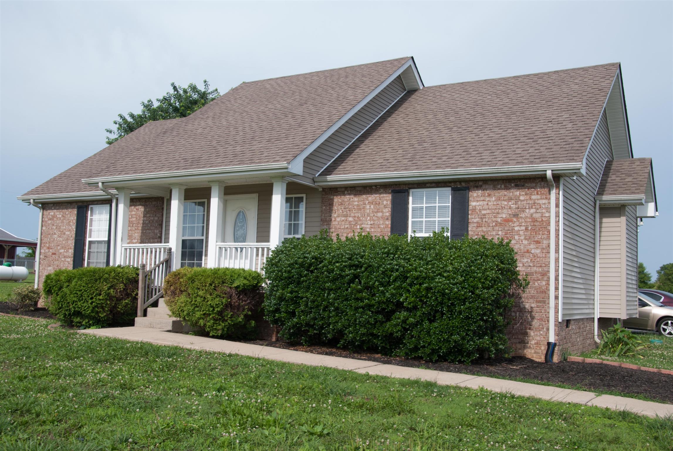718 Lear Road Portland, TN 37148 - Photo 2 of 17 a front view of a house with a yard