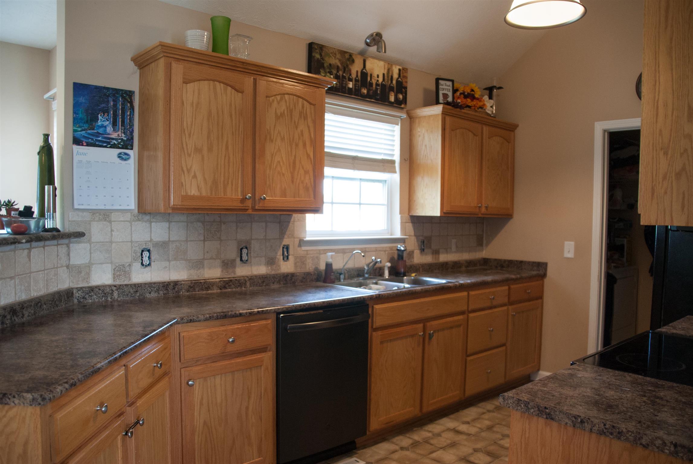 718 Lear Road Portland, TN 37148 - Photo 7 of 17 a kitchen with a sink stove and cabinets