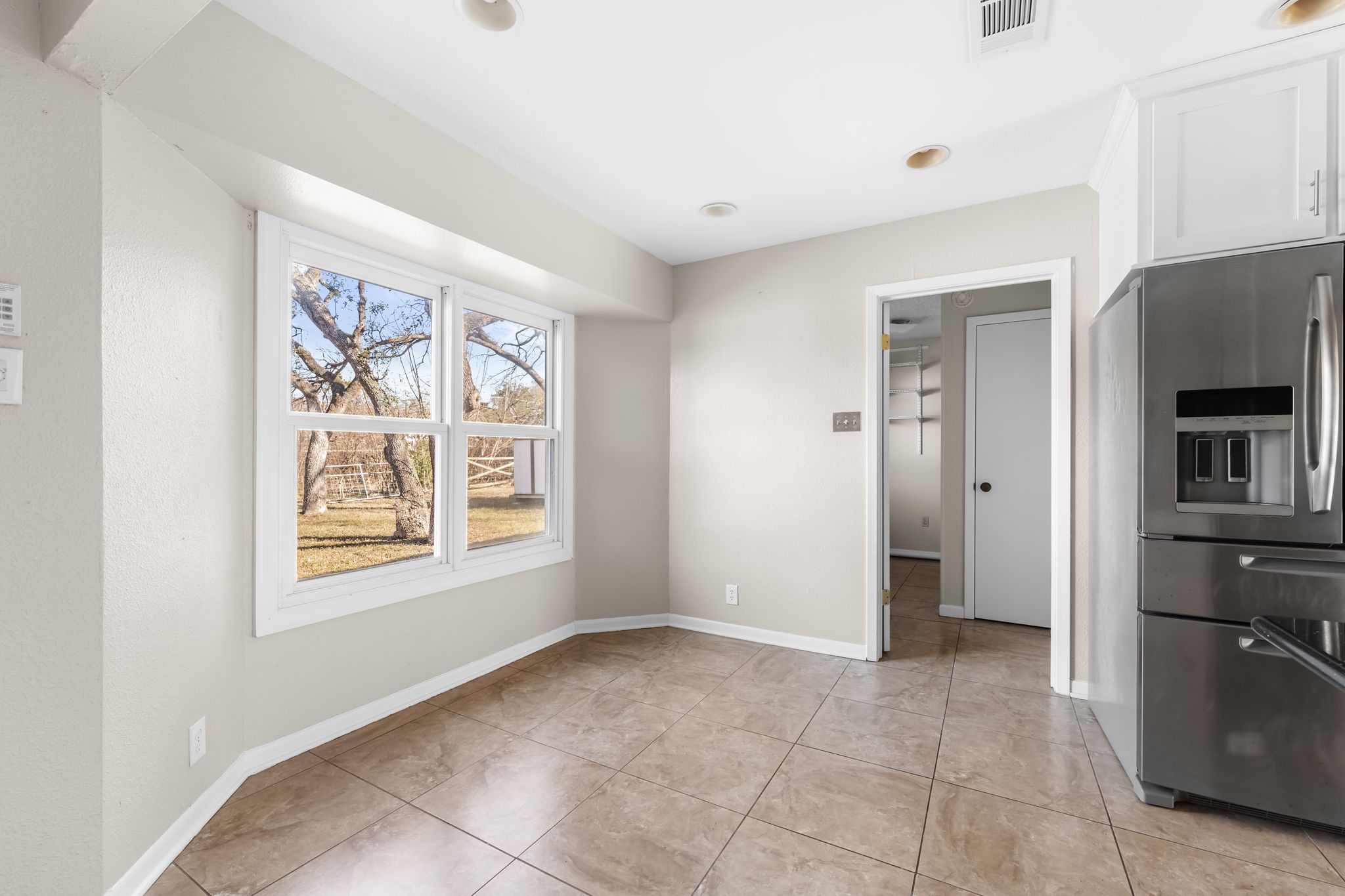 13203 Stillforest Street Austin, TX 78729 - Photo 11 of 33 a view of an empty room with a window