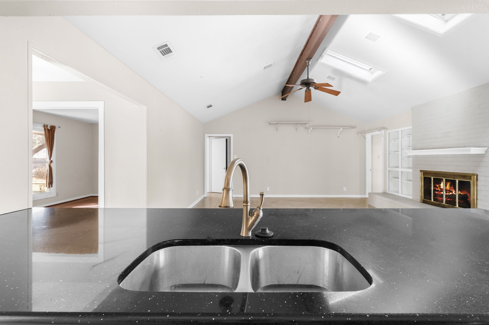 13203 Stillforest Street Austin, TX 78729 - Photo 32 of 33 a kitchen with a sink a counter space and cabinets