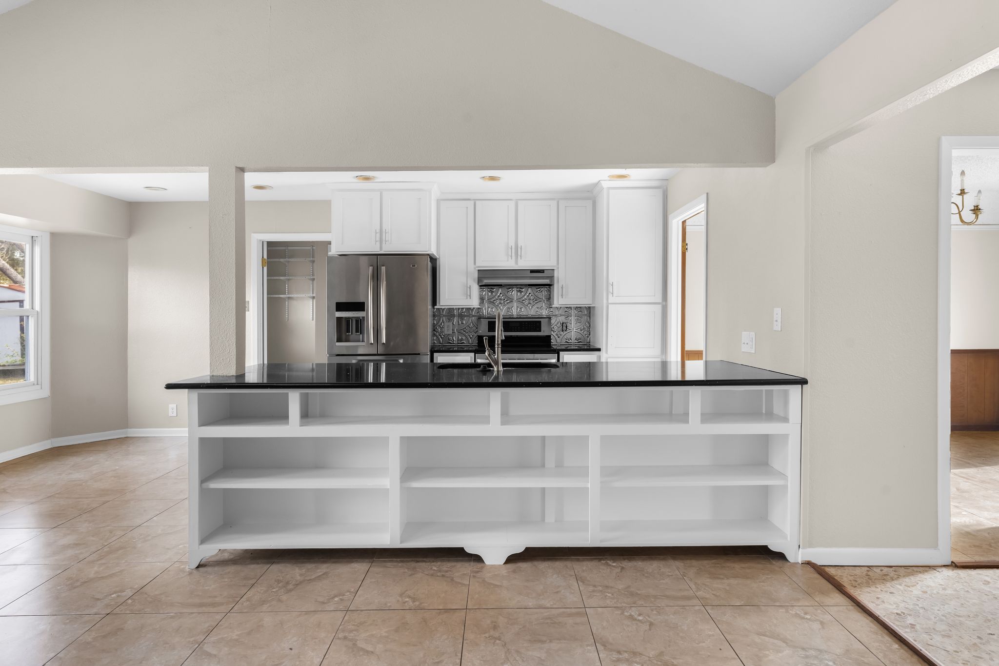 13203 Stillforest Street Austin, TX 78729 - Photo 12 of 33 a view of kitchen with cabinets and window