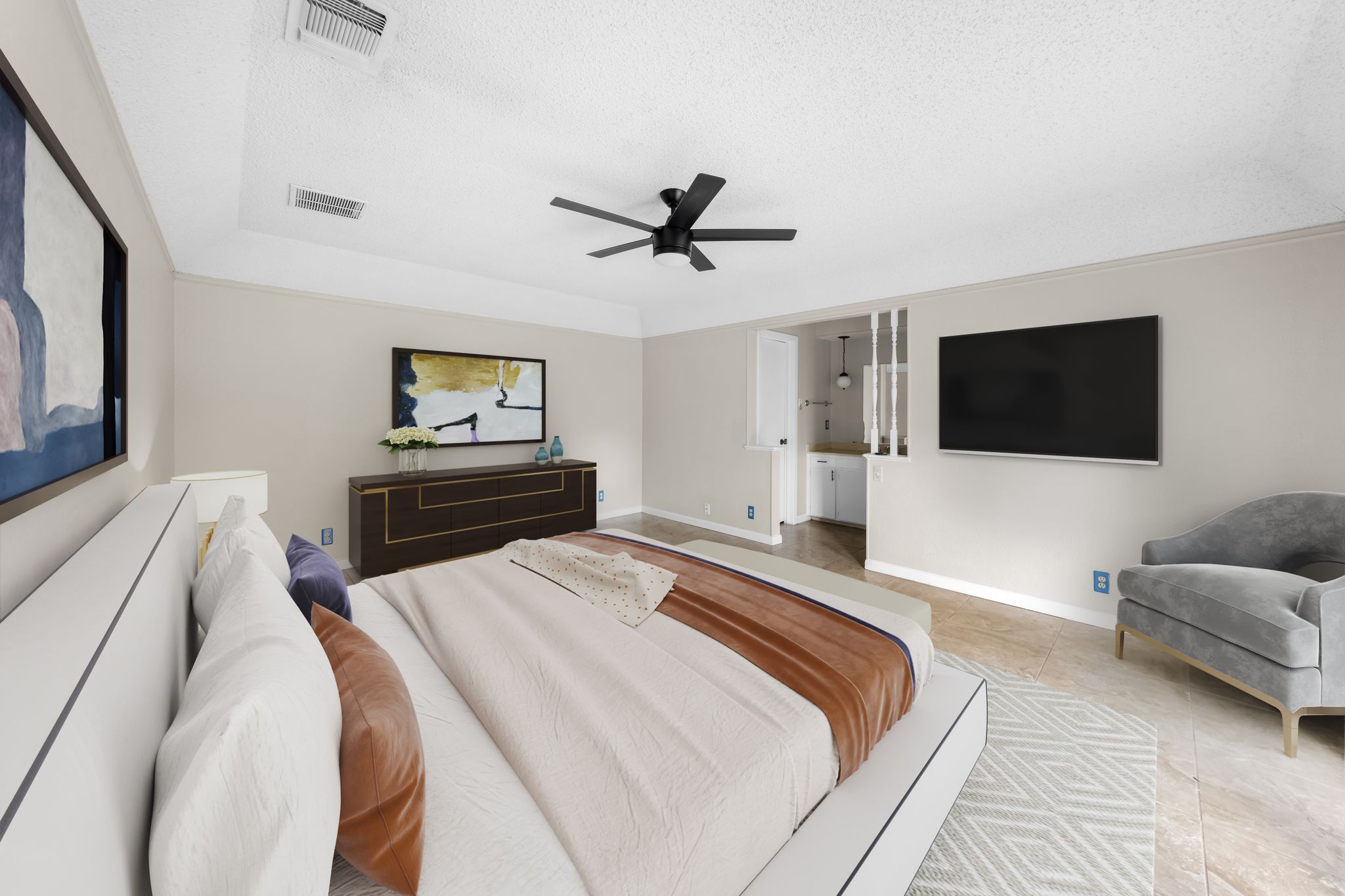 13203 Stillforest Street Austin, TX 78729 - Photo 13 of 33 a bedroom with a bed and a flat screen tv