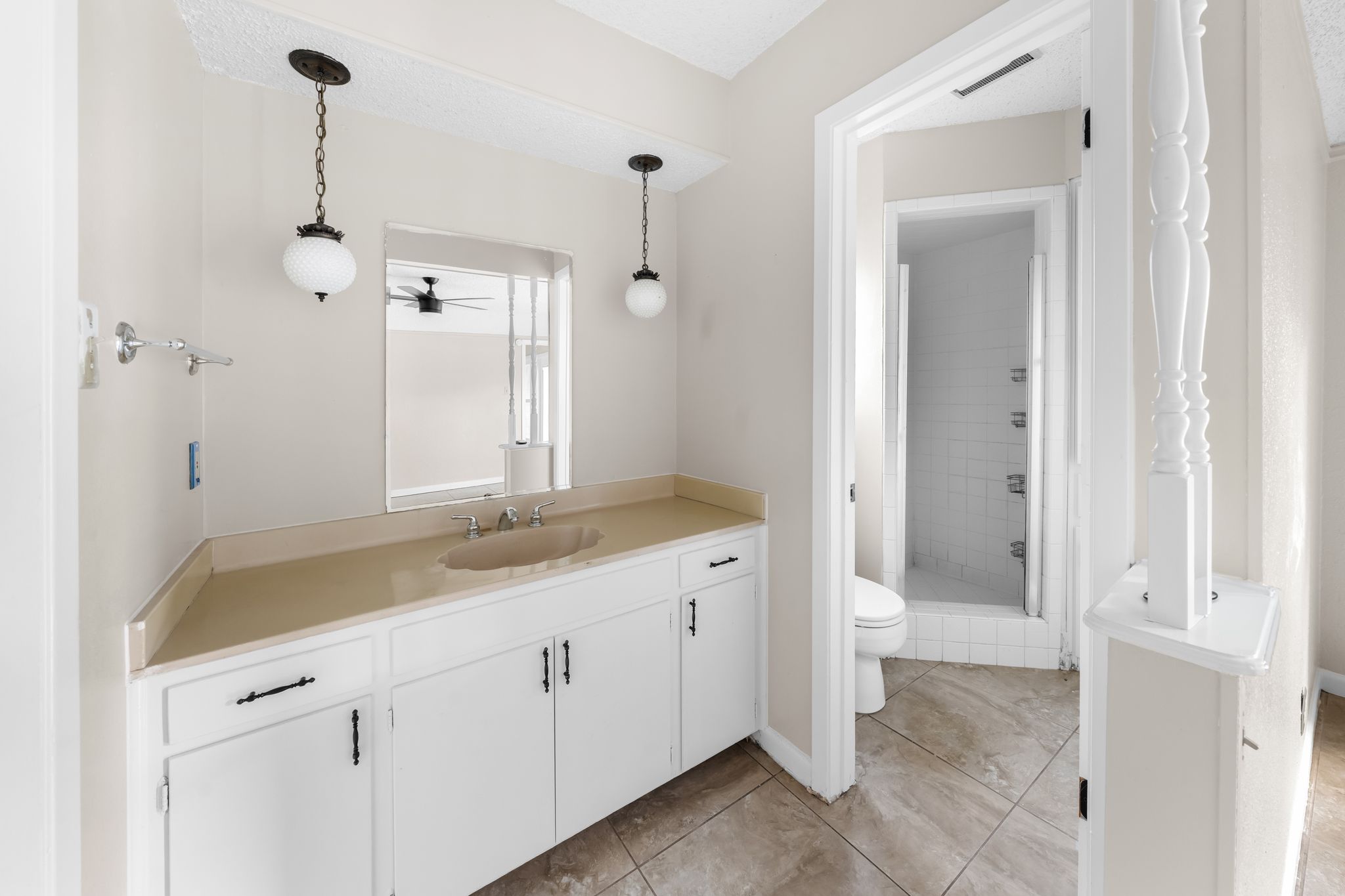 13203 Stillforest Street Austin, TX 78729 - Photo 18 of 33 a bathroom with a granite countertop sink a toilet and shower