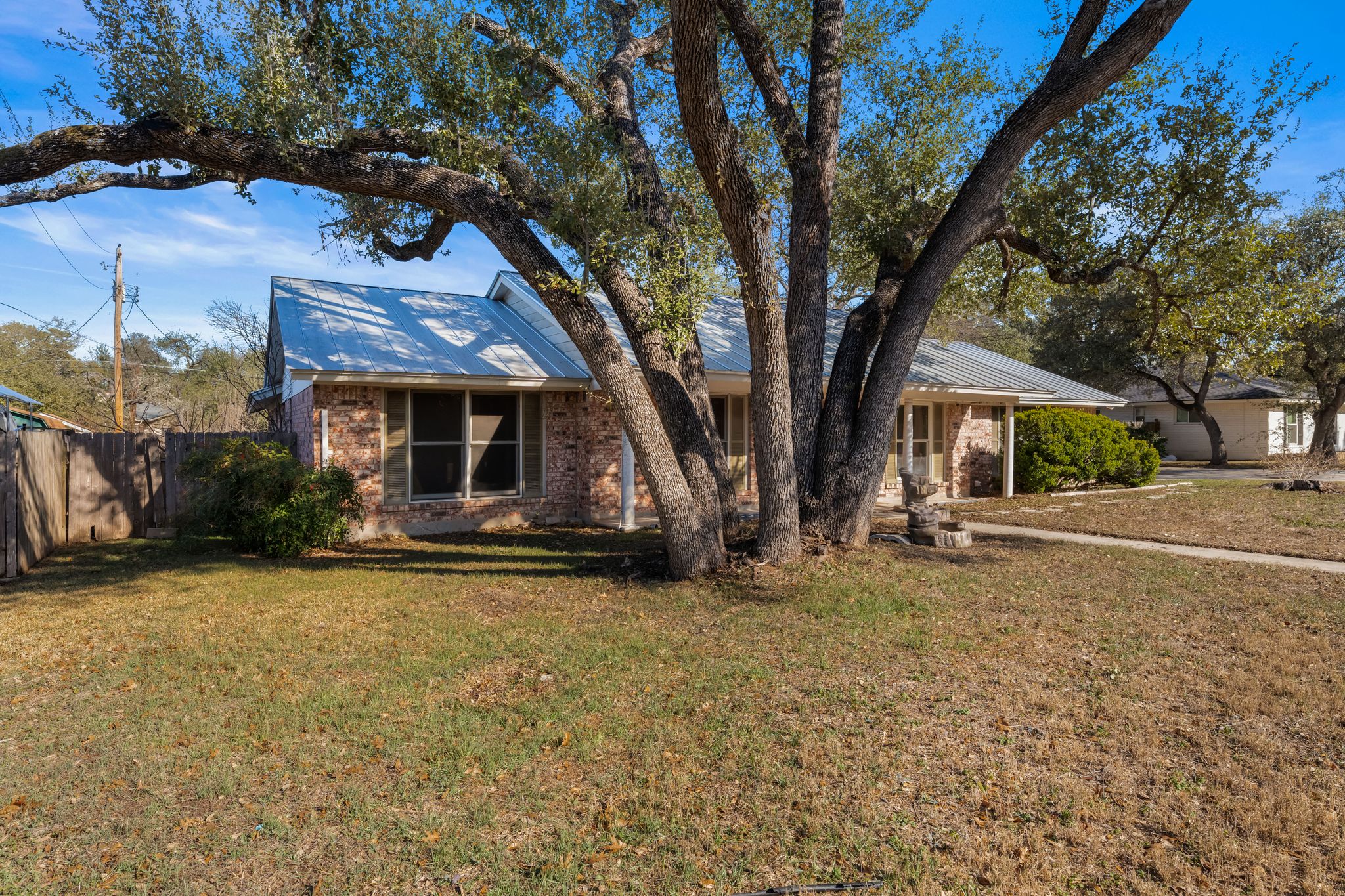 13203 Stillforest Street Austin, TX 78729 - Photo 2 of 33 a front view of a house with garden