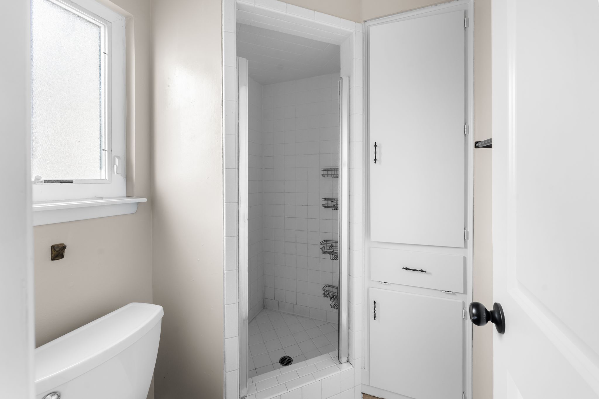 13203 Stillforest Street Austin, TX 78729 - Photo 20 of 33 a bathroom with a shower and toilet