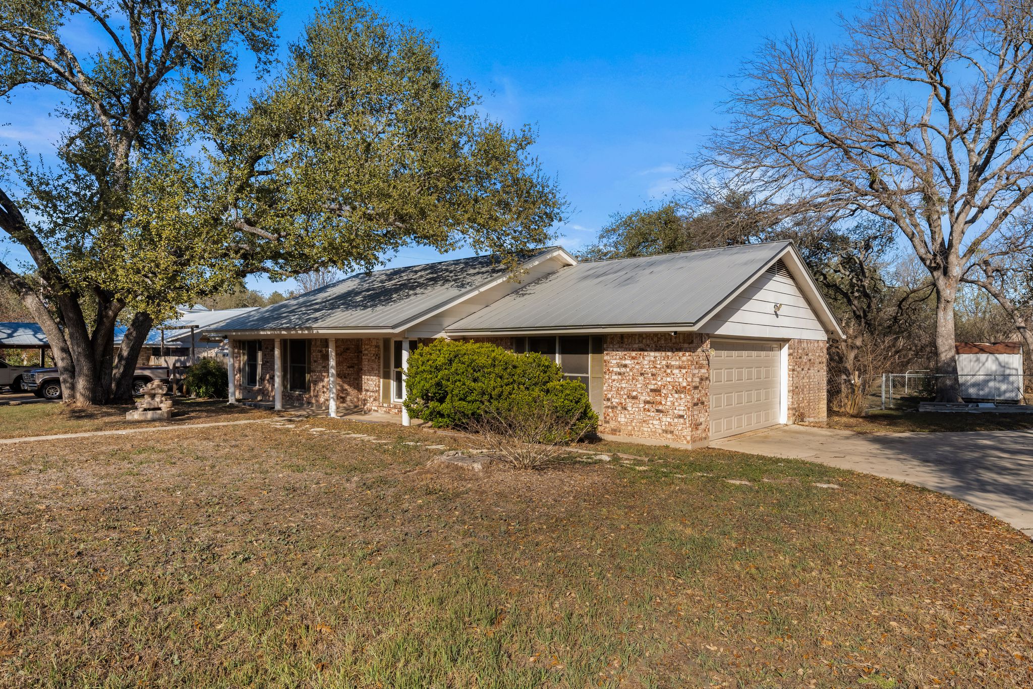 13203 Stillforest Street Austin, TX 78729 - Photo 30 of 33 a front view of a house with a yard and garage