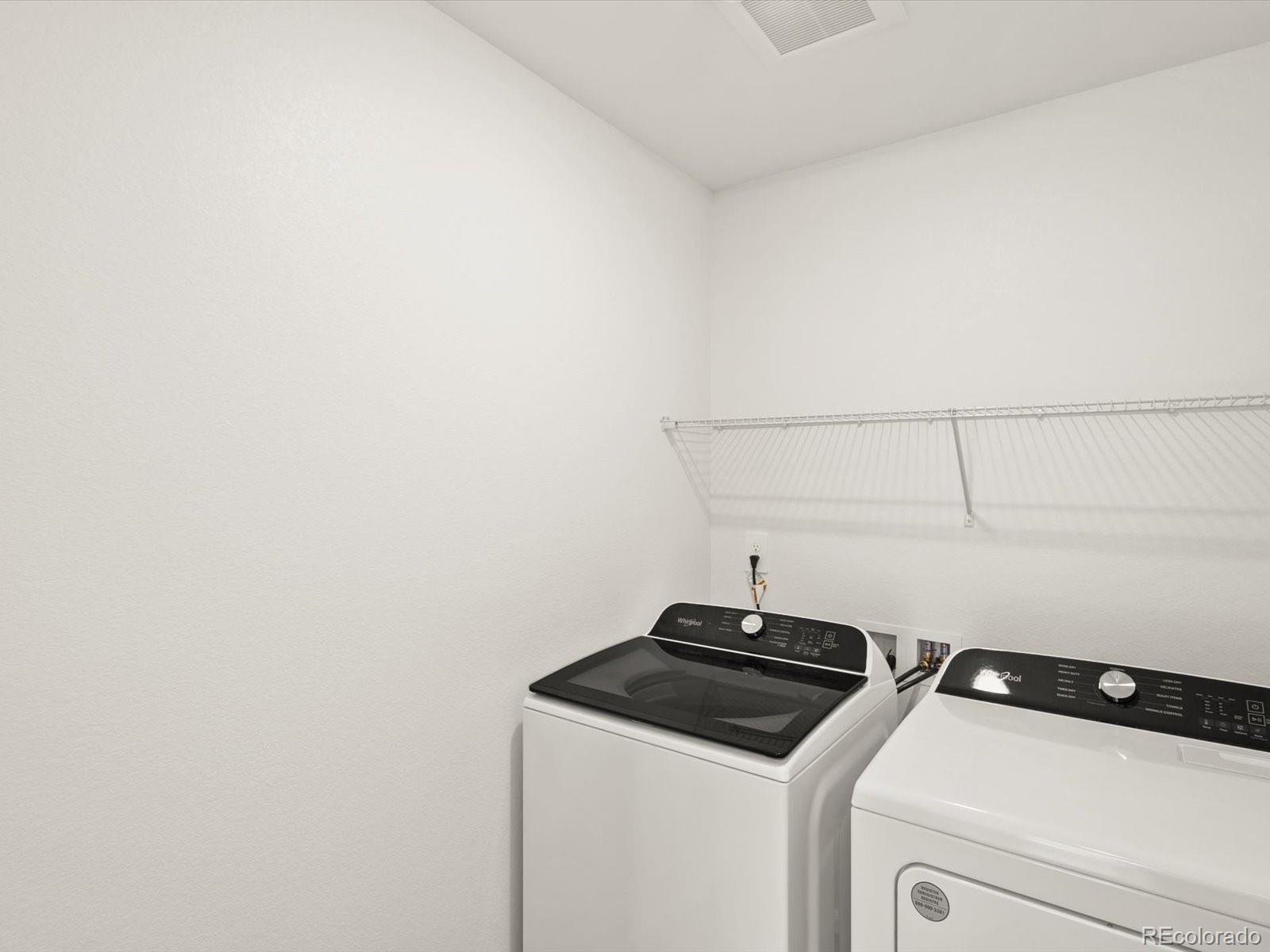 7343 West 27th Street Greeley, CO 80634 - Photo 20 of 29 a utility room with dryer and washer