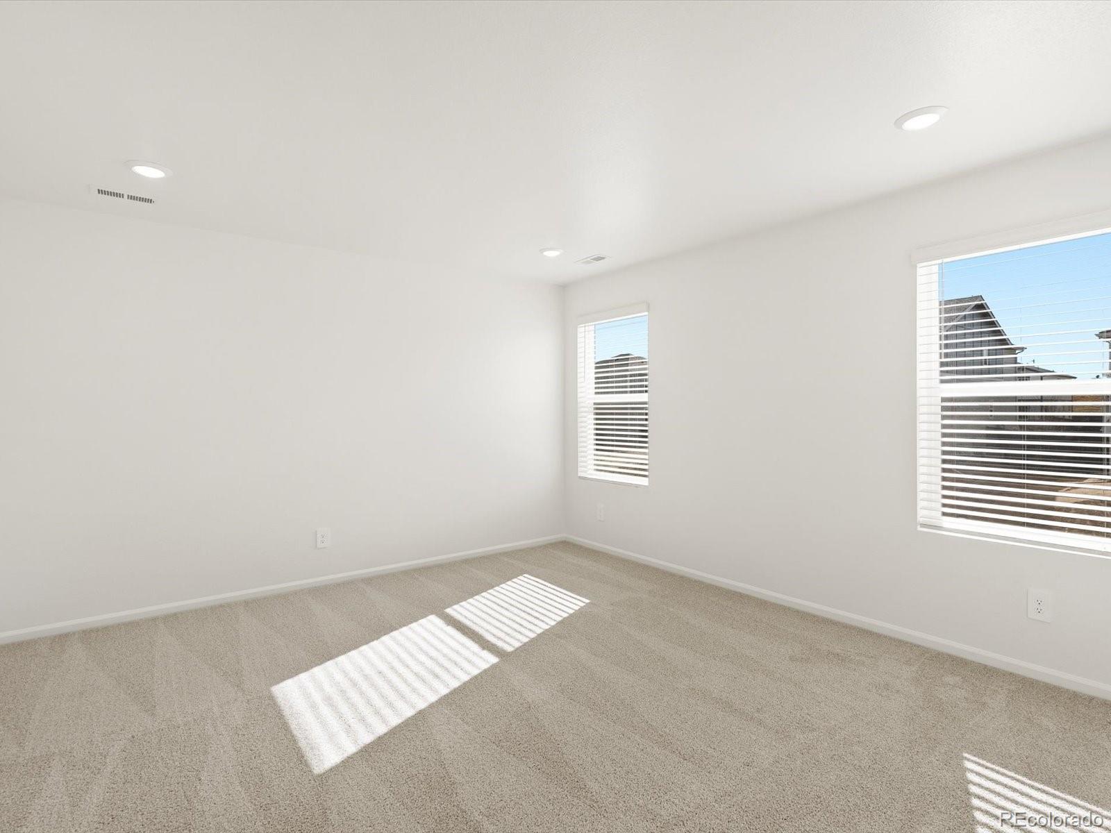 7343 West 27th Street Greeley, CO 80634 - Photo 21 of 29 an empty room with windows