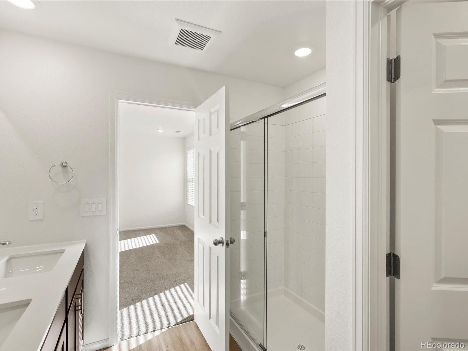 7343 West 27th Street Greeley, CO 80634 - Photo 24 of 29 a bathroom with a shower and a tub
