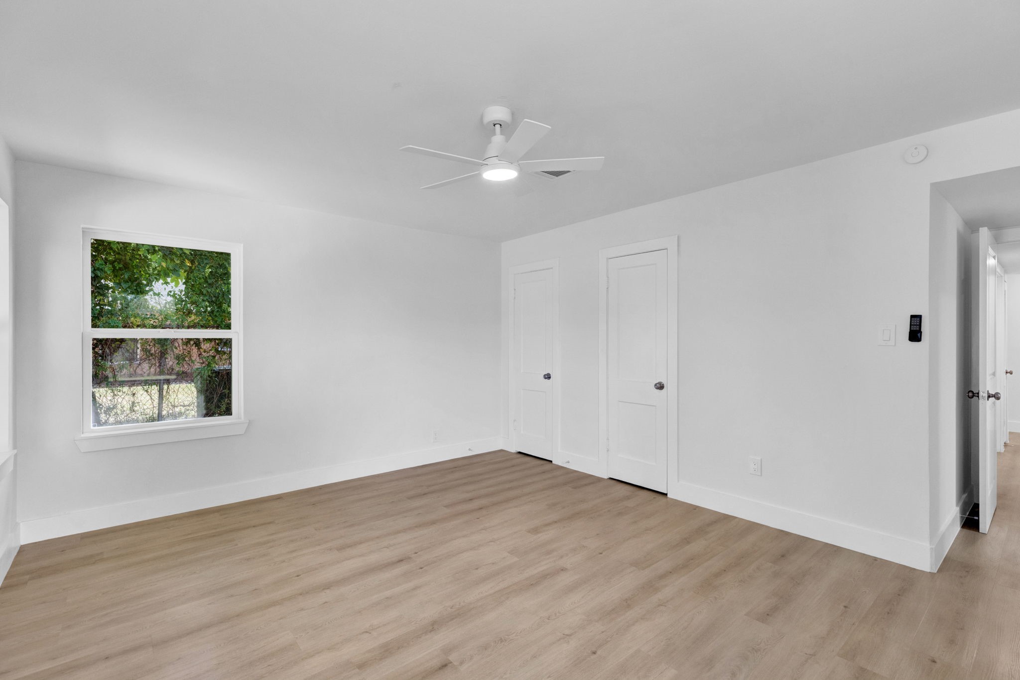 3511 Arbor Street Houston, TX 77004 - Photo 14 of 17 a view of empty room with wooden floor and fan