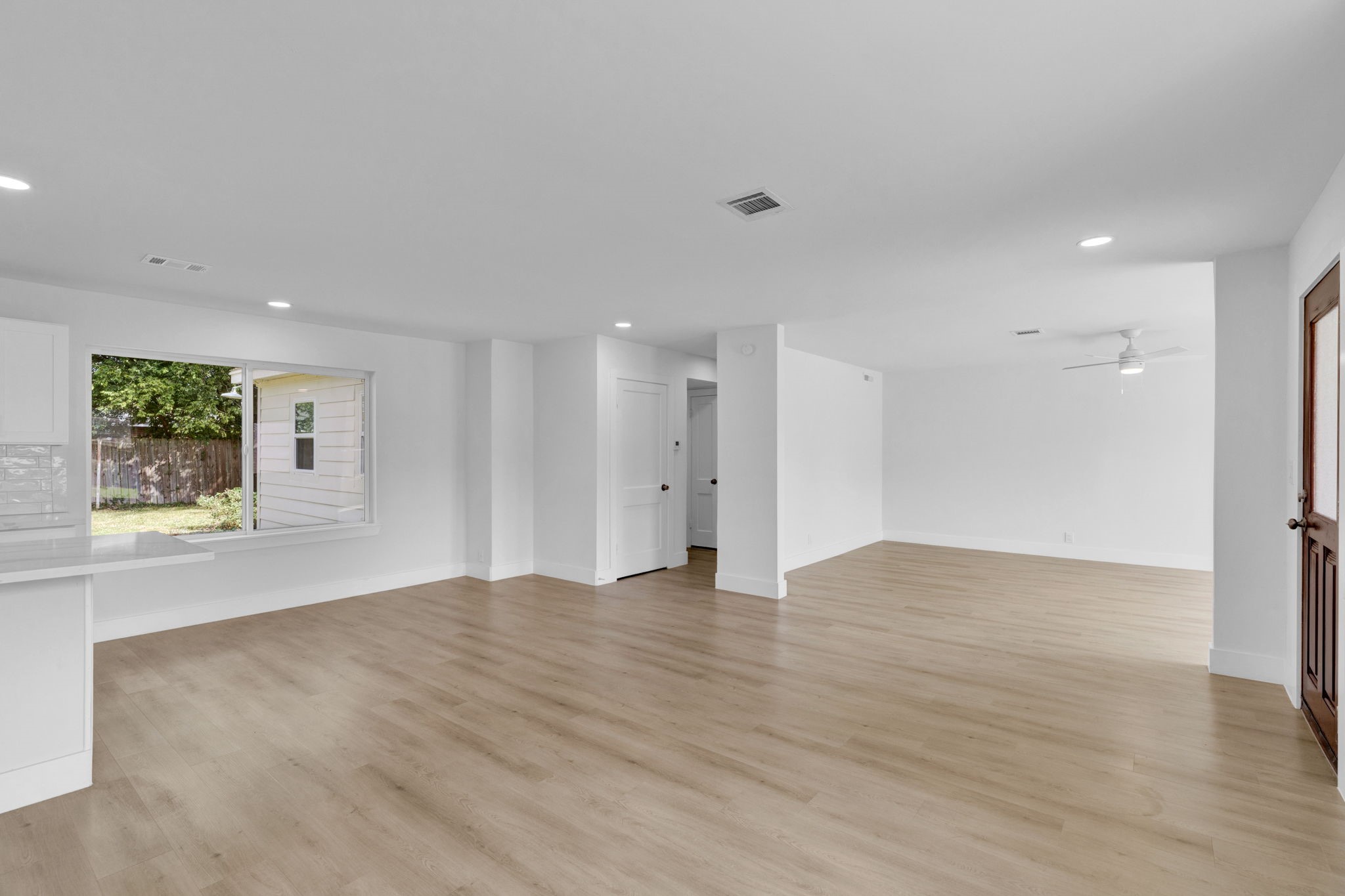 3511 Arbor Street Houston, TX 77004 - Photo 3 of 17 a view of an empty room with wooden floor and a window