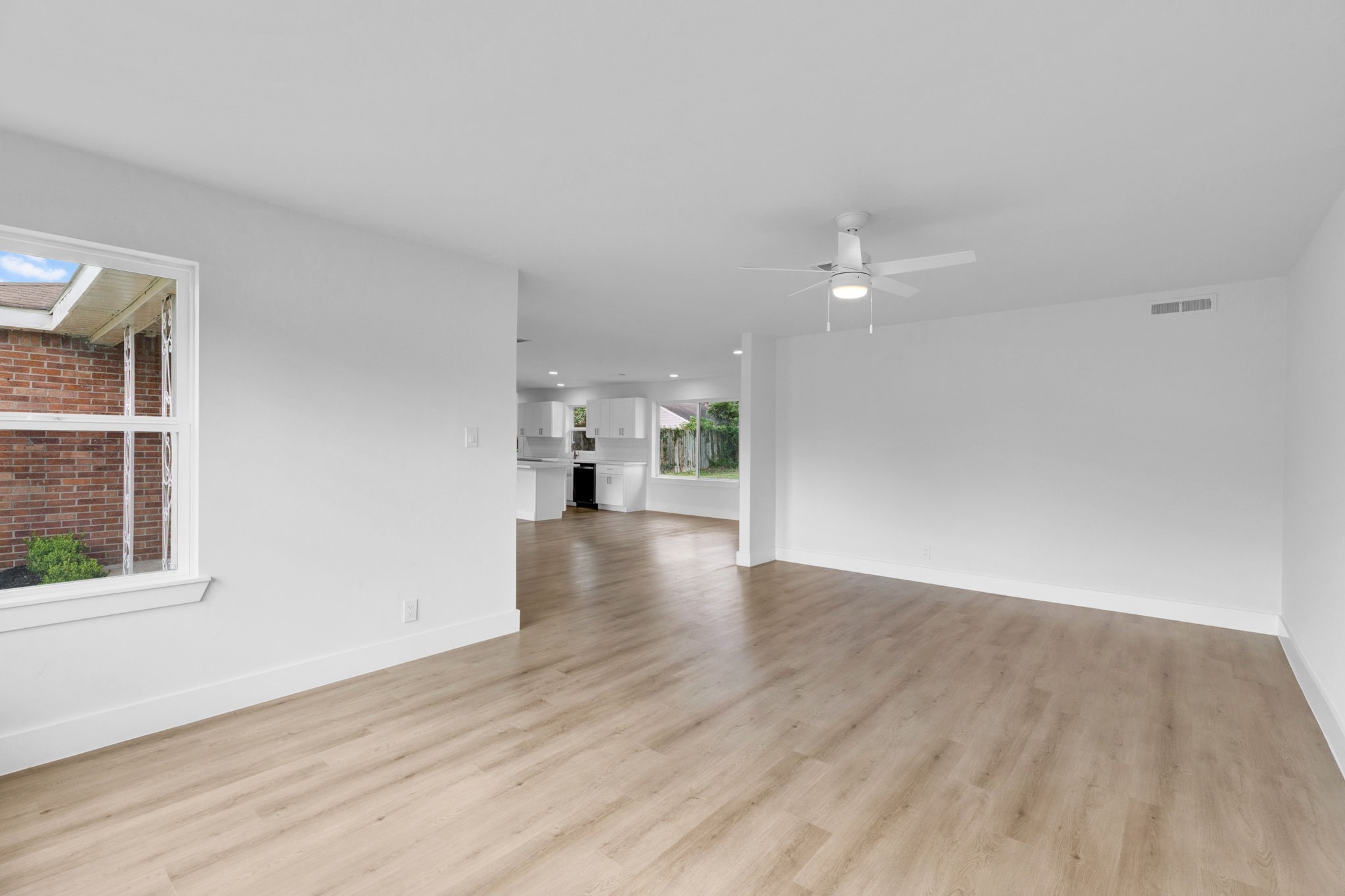 3511 Arbor Street Houston, TX 77004 - Photo 7 of 17 wooden floor in an empty room with a window