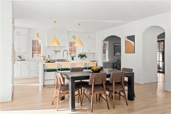 a view of a dining room with furniture window and wooden floor