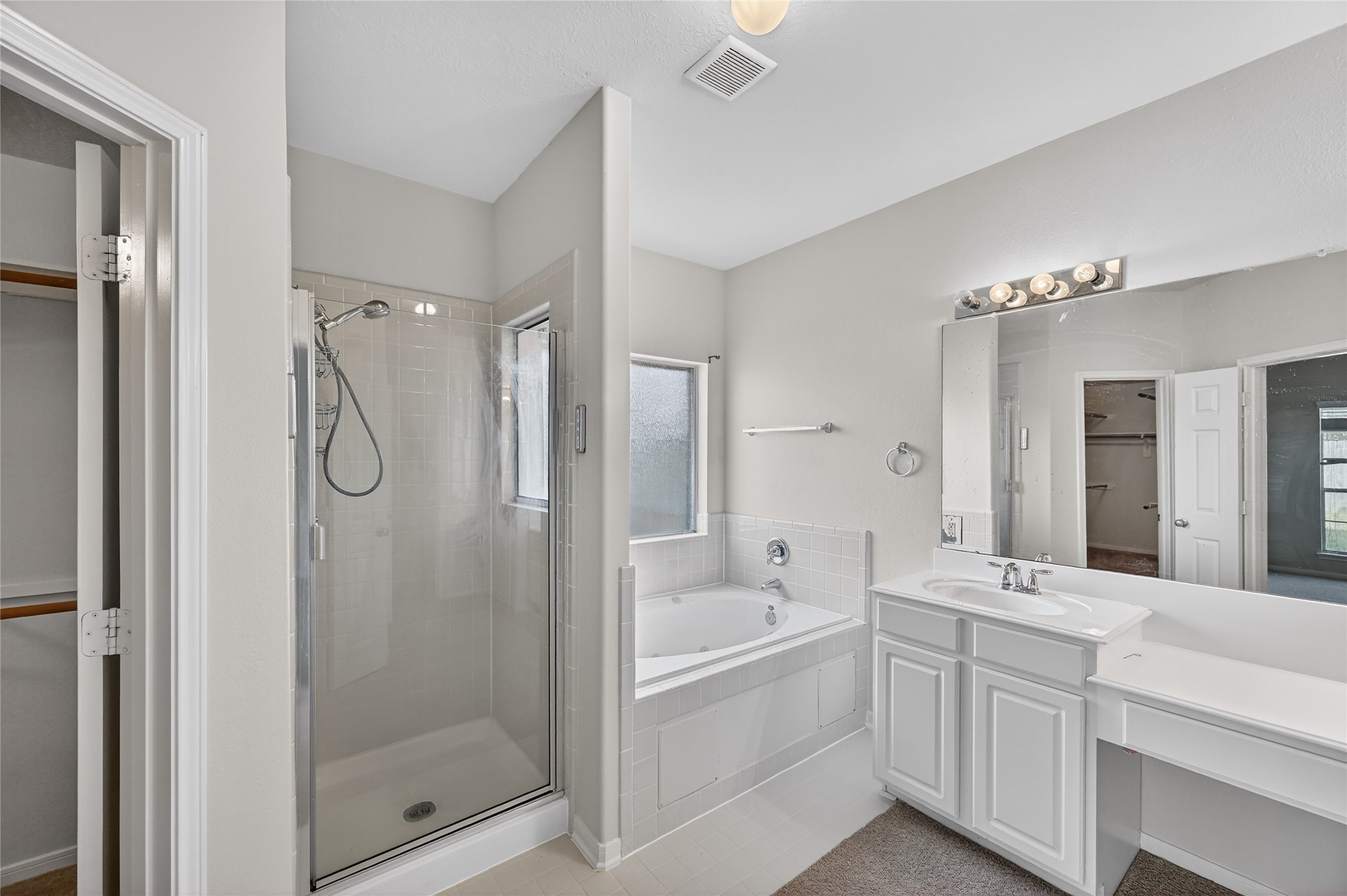 14903 Hurst Point Lane Houston, TX 77049 - Photo 7 of 17 a bathroom with a double vanity sink mirror and shower