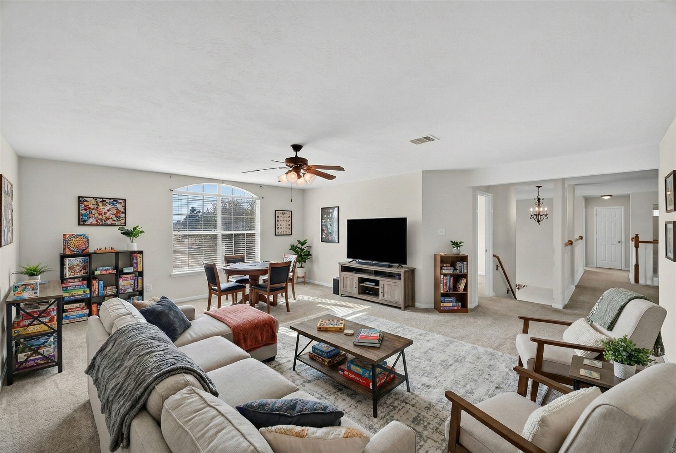 14903 Hurst Point Lane Houston, TX 77049 - Photo 9 of 17 a living room with furniture and a flat screen tv